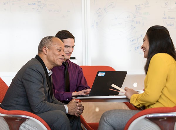 insurance brokers discussing insurance plans with clients